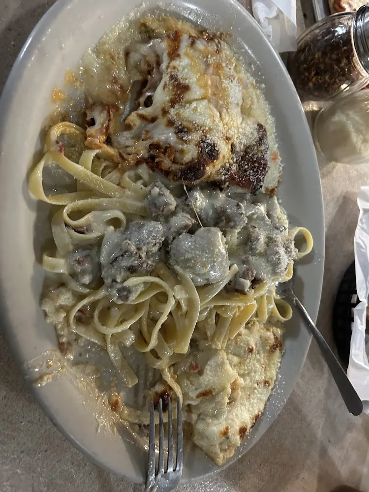 Three Tours of Italy Chicken Parmigiana Lasagna and Seafood Alfredo with Meatballs and Sausage